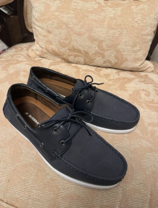 Sapatos de vela da quebramar