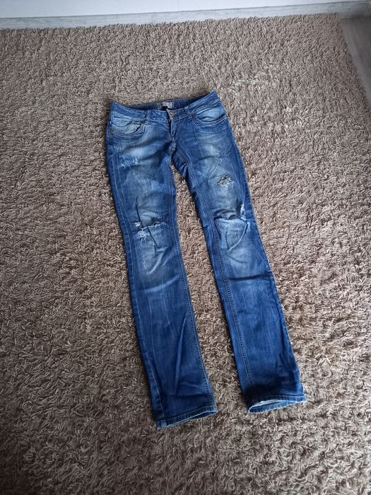 Jeansy spodnie z dziurami 28/34