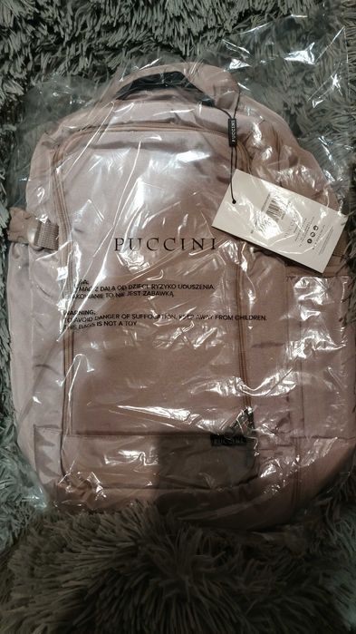 Jasno różowy nowy plecak Puccini do samolotu 23l