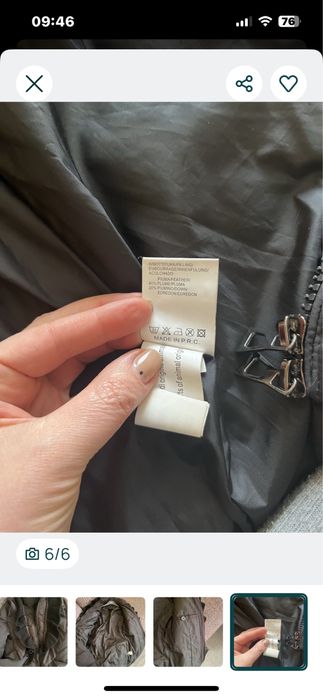 Пуховик чорного кольору