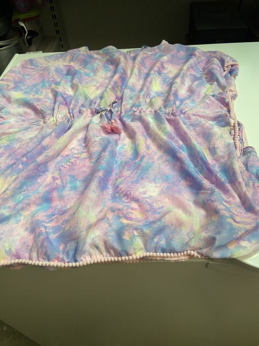 Tres fatos de banho e dois vestidos de praia