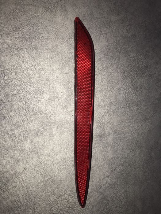 Отражатель заднего бампера левый Tesla mod 3