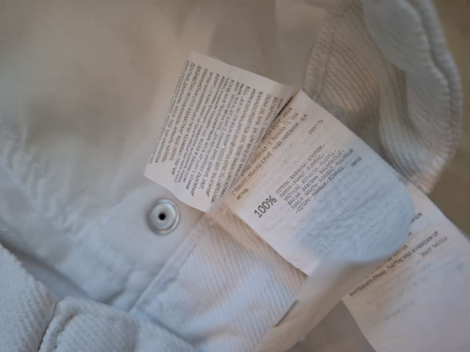 Białe spodnie jeansy straight fit sinsay 40