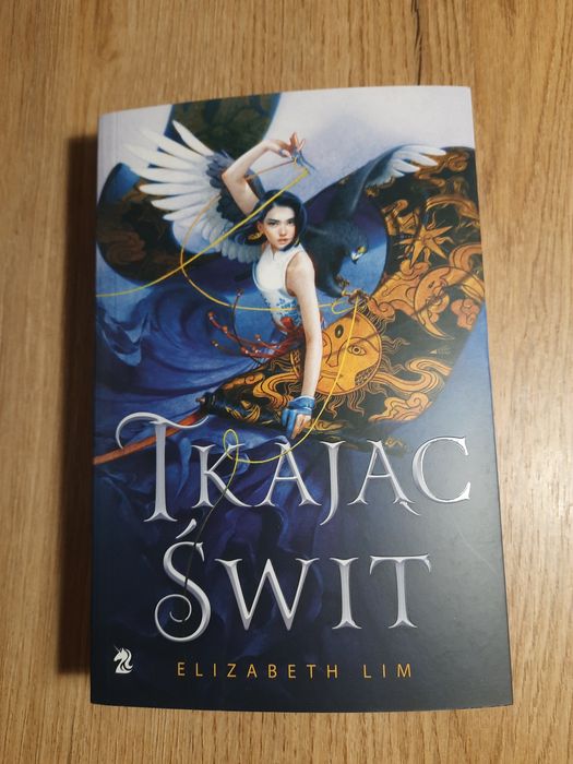 Książka tkając świt