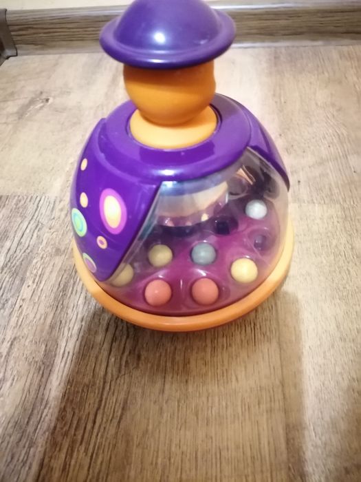 Продам детские игрушки (игрушка на коляску,юла, мягкие игрушки)