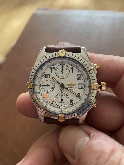 Relogio breitling cronomat aço e ouro e raymond weill modelo othelo.