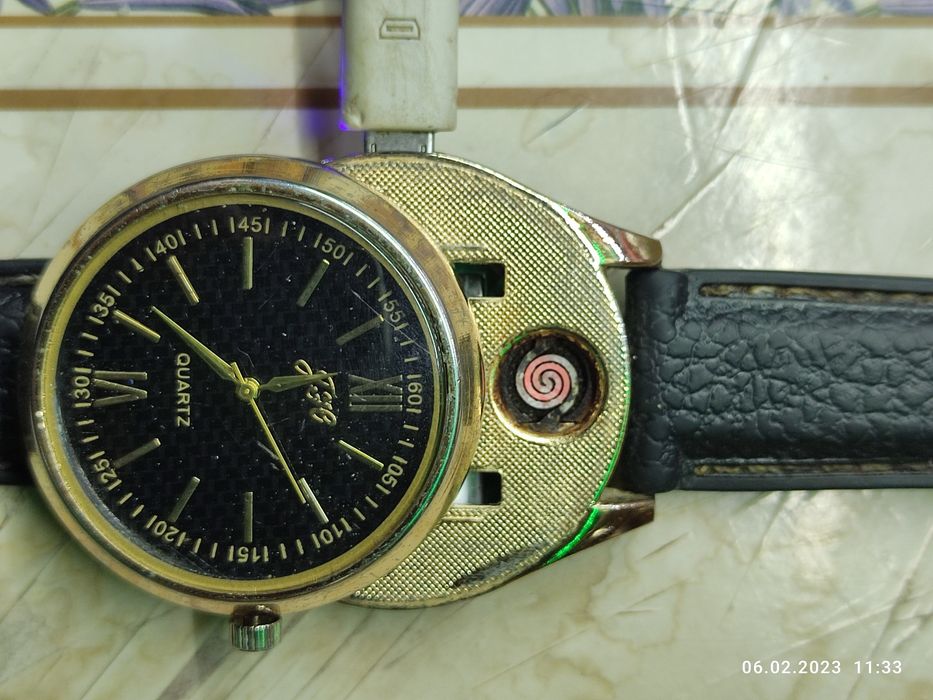 Часы с зажигалкой,зарядкой.