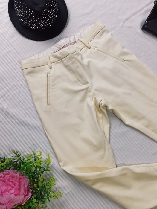 Sg Spodnie damskie 38 , 40 Angelie Zip eleganckie śmietankowe spodnie