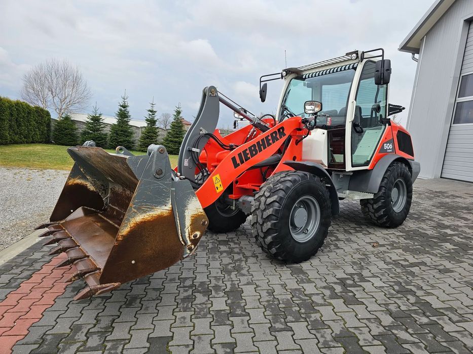 Liebherr L 506 C Compact  Z Niemiec / 562 mth / 2023 rok / szczęka + widły / 506C L507 508 509
