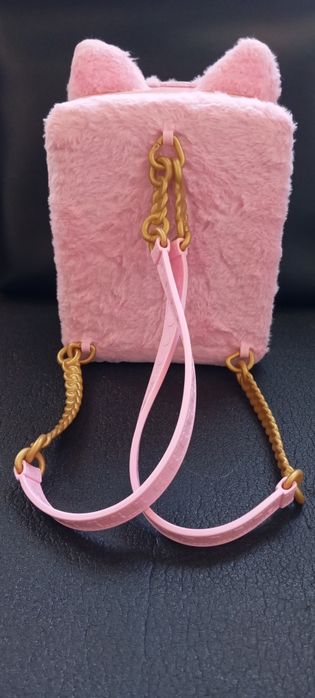 Boneca Na Na Na mochila surpresa 3 em 1.