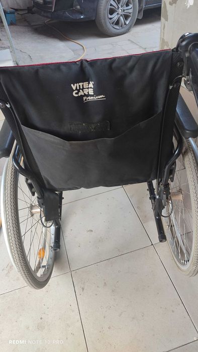 Коляска инвалидная без подножек с дополнительн. тормозом для помощника