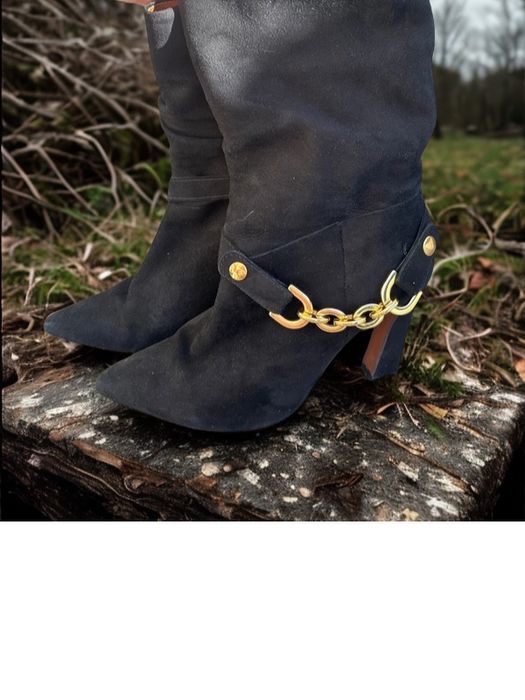 Botas pretas com salto da Ruikä