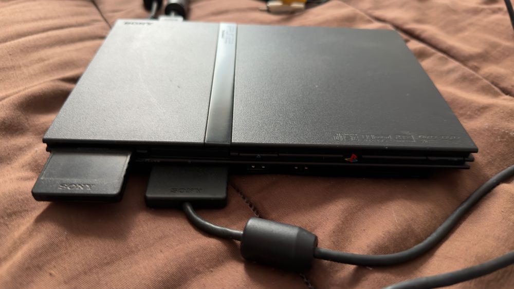 Ps2 Slim como nova + jogos+ cartão de memoria