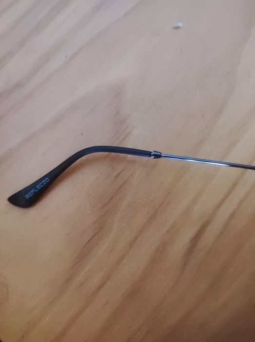 Óculos sol marca reflexo