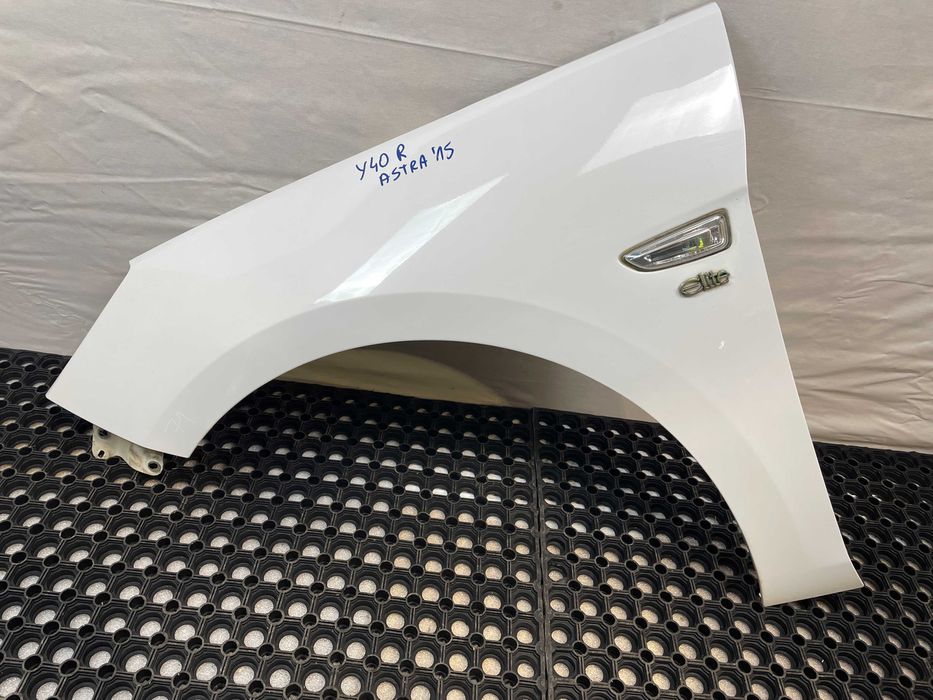 Błotnik przód przedni lewy opel astra v k kod lakieru: y40r 2015-