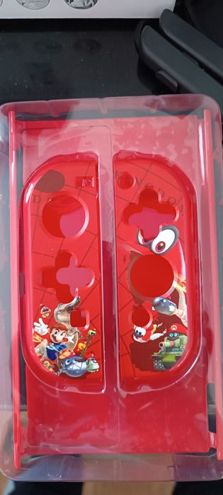 Lote de artigos Switch OLED. Capa SUPER MARIO. Joycon holder, etc.