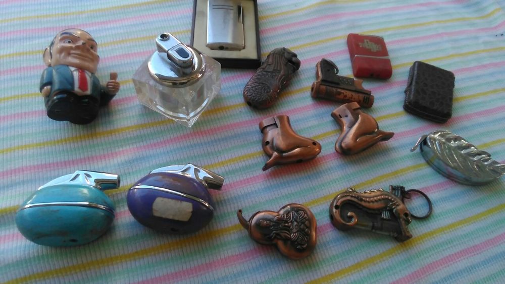 Vários isqueiros em metal novos.(encerramento de papelaria)