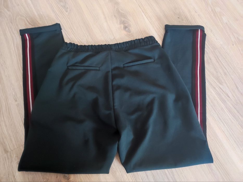 Damskie zielone spodnie z lampasem elastyczne r 40 L