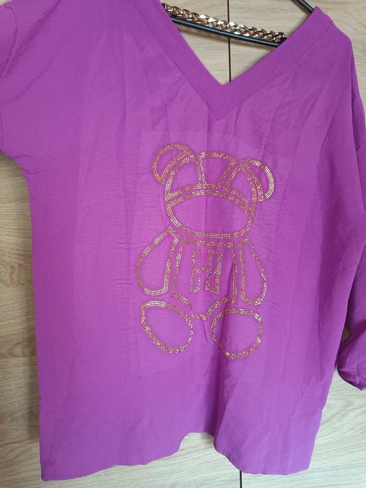 Nowa piękna bluzka z wywijanym rękawem