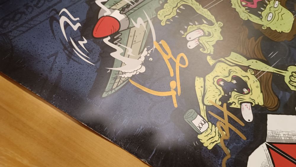 Plakat Airbourne z podpisami całego zespołu