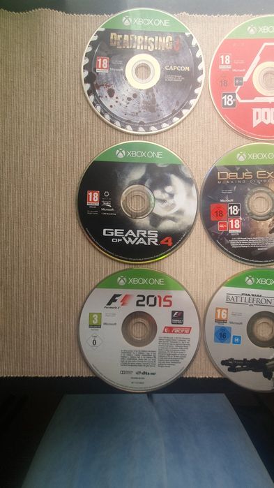 Jogos para Xbox One e Guarda-Discos( só vendo o conjunto todo)