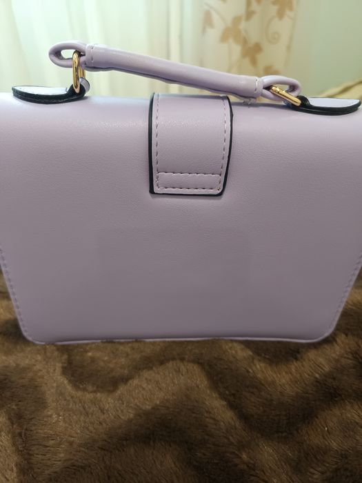 Mala de mão e a tiracolo e porta moedas