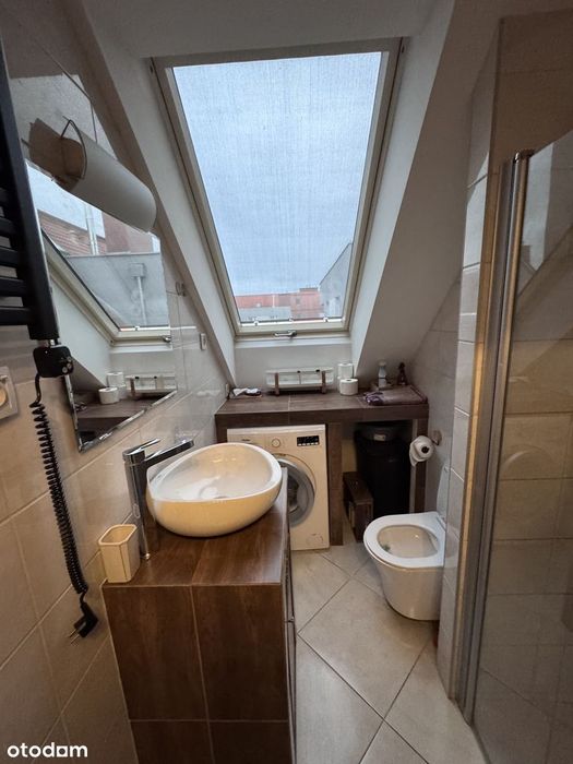 Kawalerka w centrum Maślic, w cenie piwnica, miejsca postojowe,