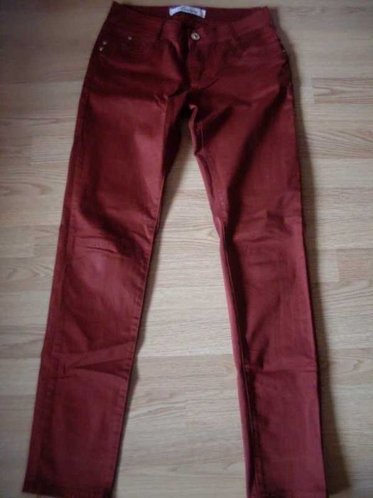 spodnie rude rurki biodrówki 38