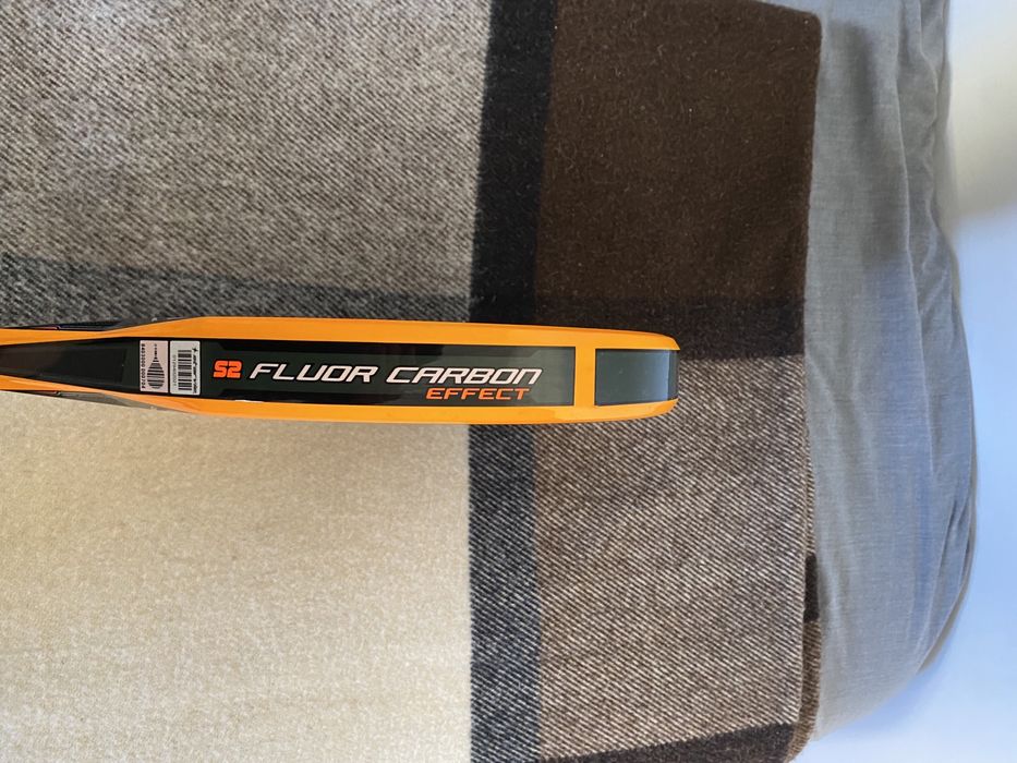 Raquete de padel da starvie laranja e preta