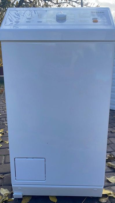 Вертикальна пральна машина Miele