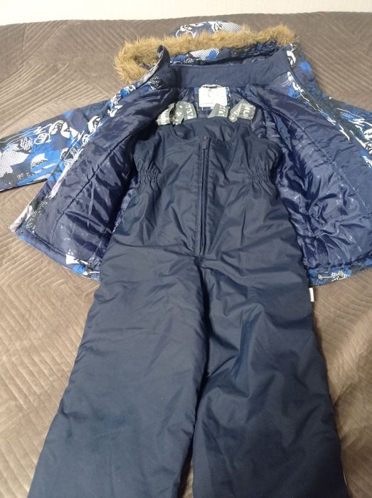 Продам зимний комбинезон Huppa