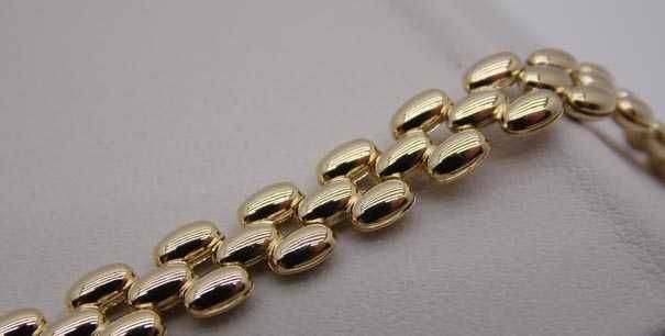 Złota bransoletka pękate ozdoby 19 cm. 6,4 mm.