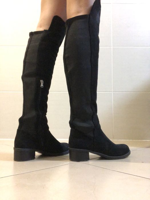 Botas pretas cano alto