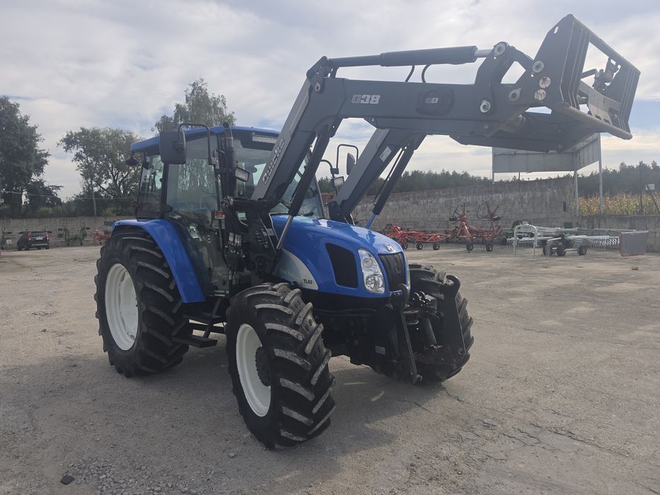 New Holland TL 80 A z ładowaczem sprowadzony Faktura
