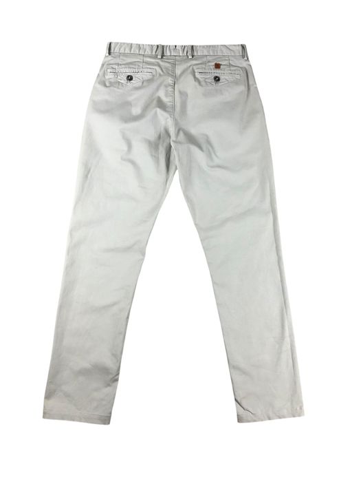 Kremowe chlopiece eleganckie spodnie chinosy Massimo Dutti
