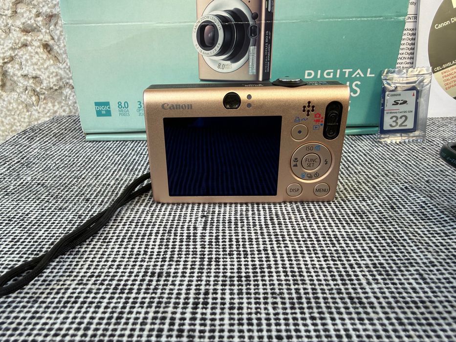 Câmara Fotográfica Canon Digital IXUS 80 IS – Caramelo / Tons Rosados – Conjunto Completo