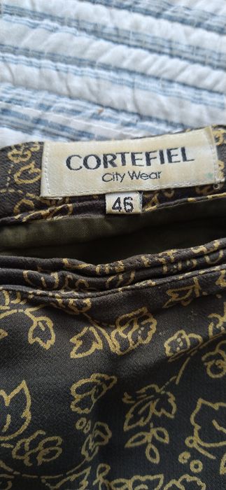 Dezenas de saias midi entre o 40 e 48