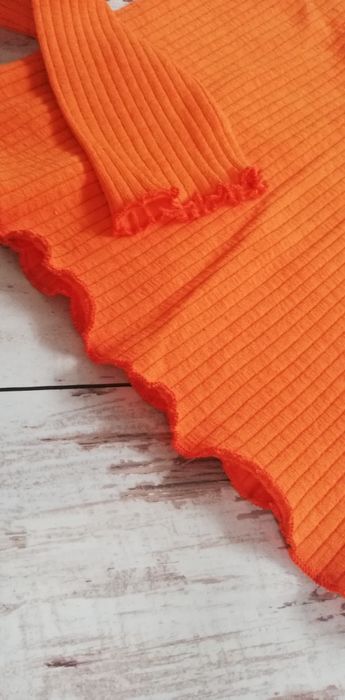 Bluzka pomarańczowa z jednym rękawem