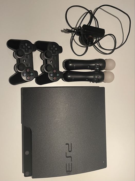 PS3 + comandos + comandos Move e câmara + jogos