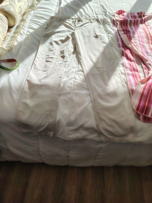 Calças cremes Lion Porsches