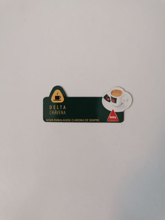 Íman de frigorífico com publicidade da Delta Cafés