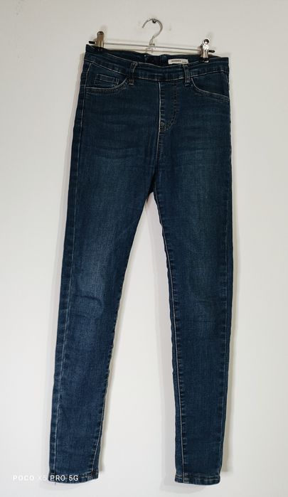 Granatowe spodnie jeansy damskie z kokardkami skinny Goodies