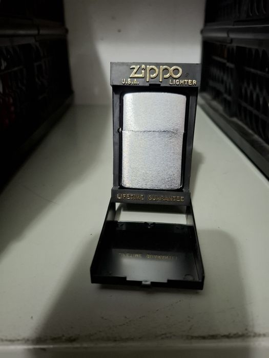 Isqueiros Zippo e bolsa de transporte