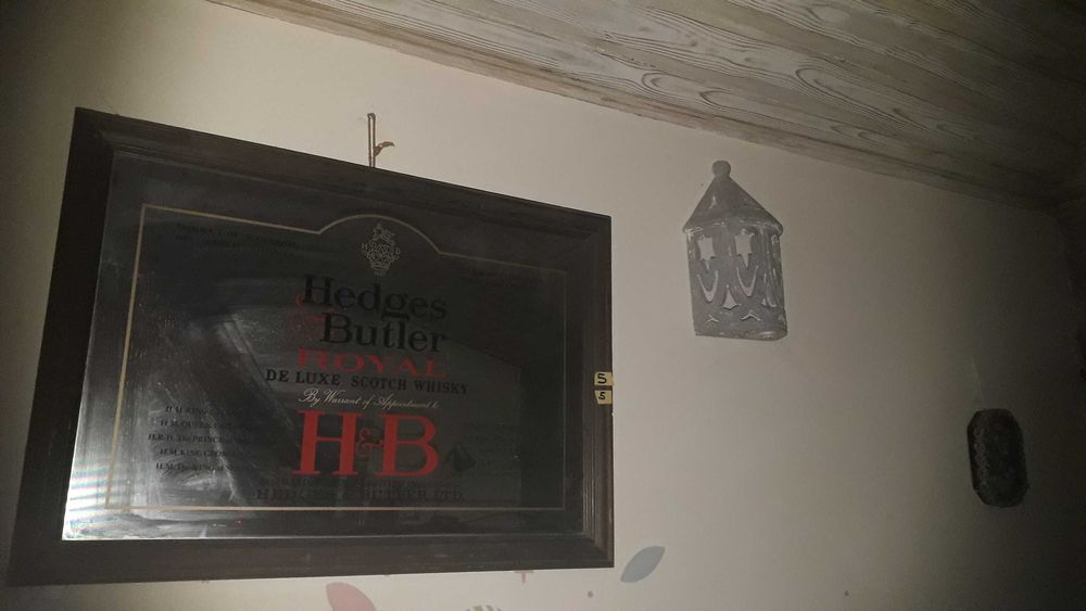 2 espelhos publicitários cafe delta e whisky h&b