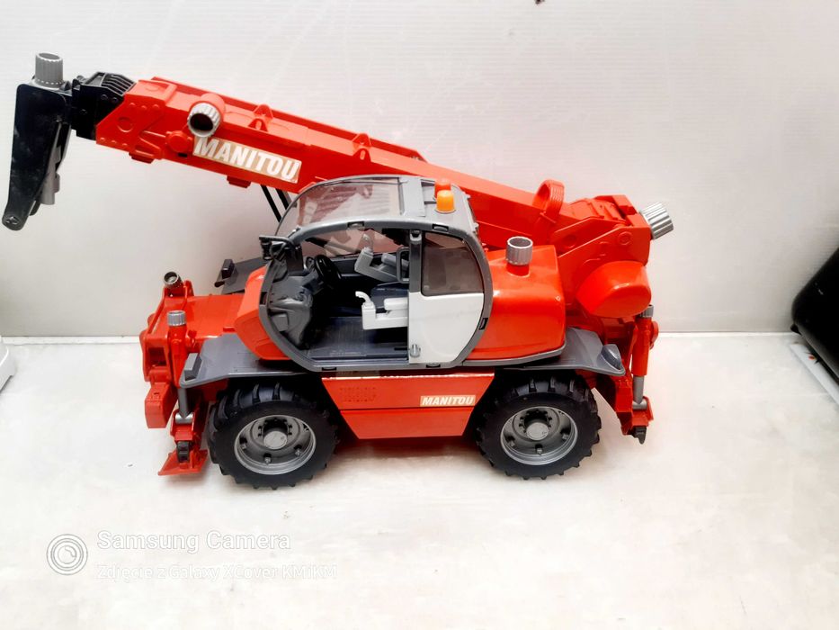 zabawka dźwig ładowarka model Bruder Manitou MRT2150 uszkodzona