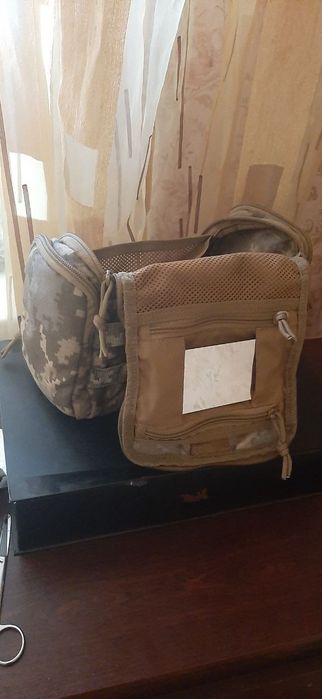 Тактическая сумочка, при небольшом дожде не промокает. Состояние идеальное