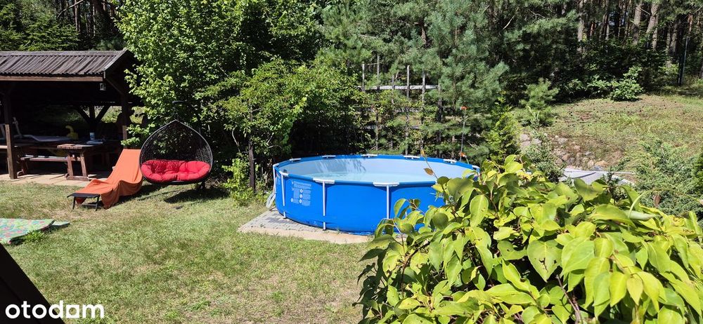 Domek letniskowy z sauną nad jeziorem, 1100m² ogrodzonego terenu.