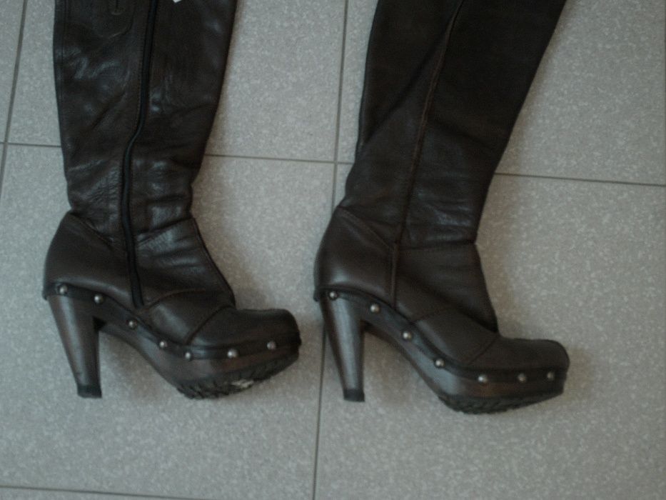 Botas practicamente novas