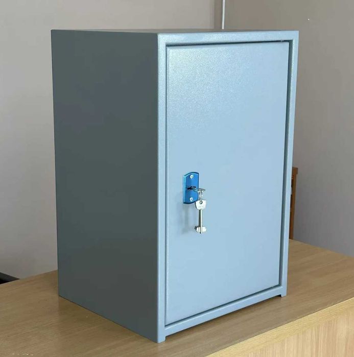 Офісний сейф для зберігання документів з касовим відділенням трейзером