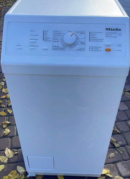 Вертикальна пральна машина Miele